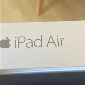 Apple iPad Air2 , iPad wiped clean, maybe 10 year’s old. Sticker and loops back.